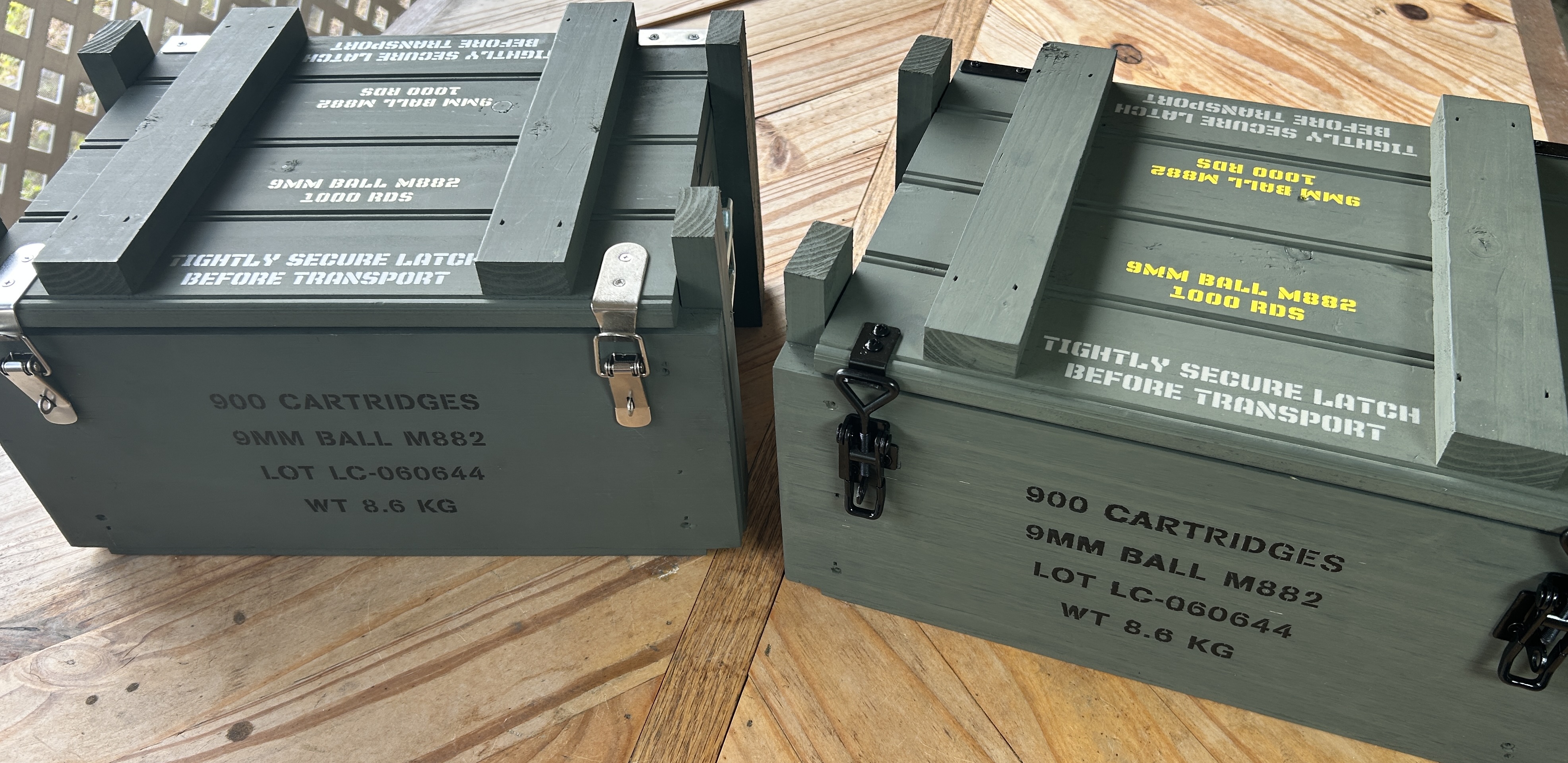 Two Caliber Collection 9mm crates side by side, one with stainless hardware and one with black hardware