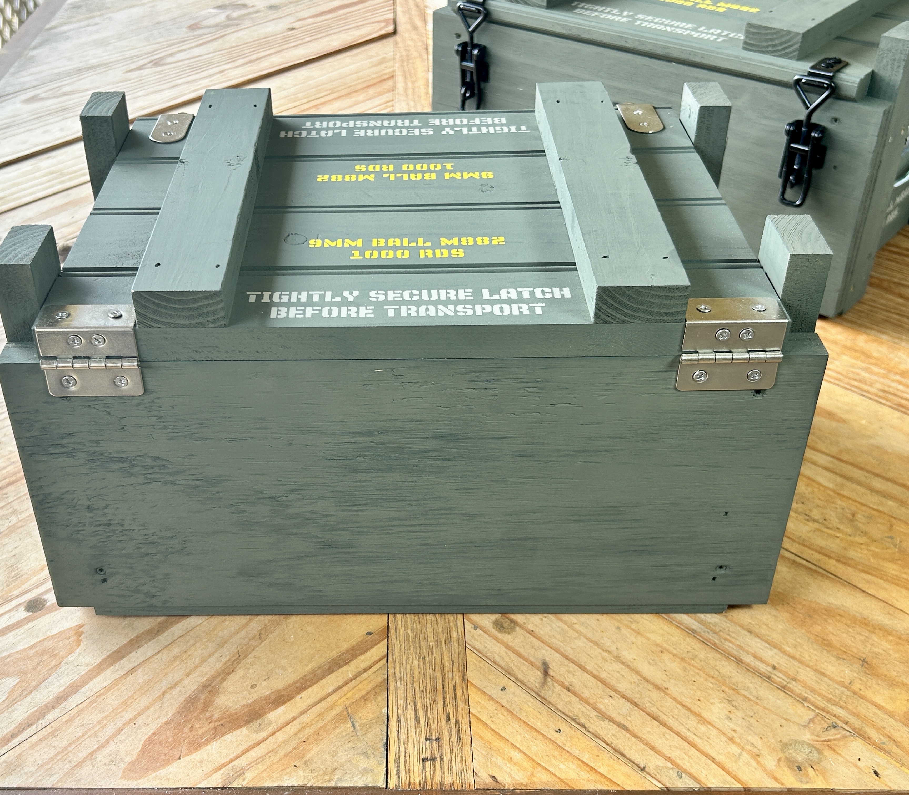 Rear view of Caliber Collection crate showing stainless tri-fold hinges