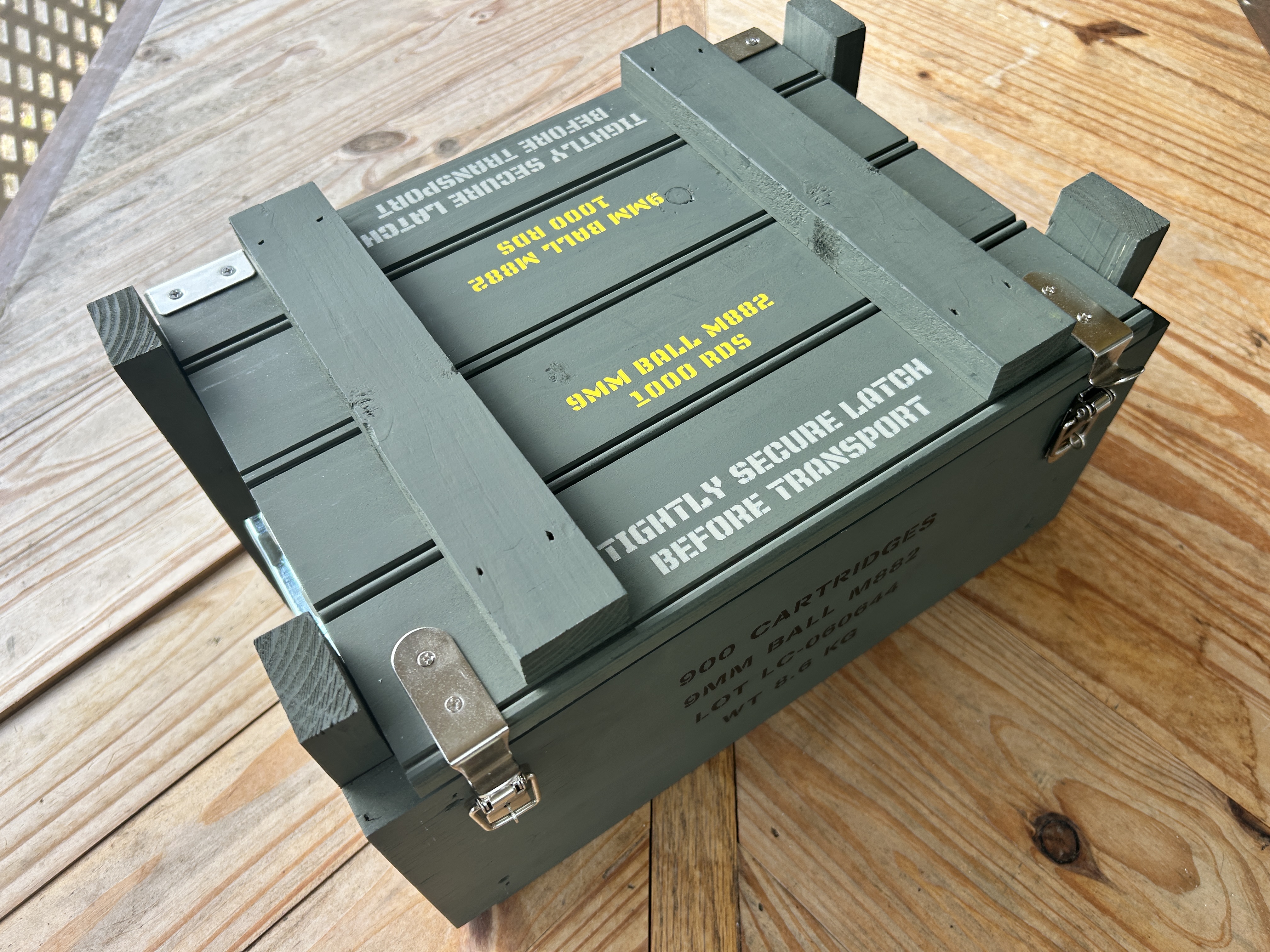Caliber Collection 9mm crate with stainless latches and top rails, angled view