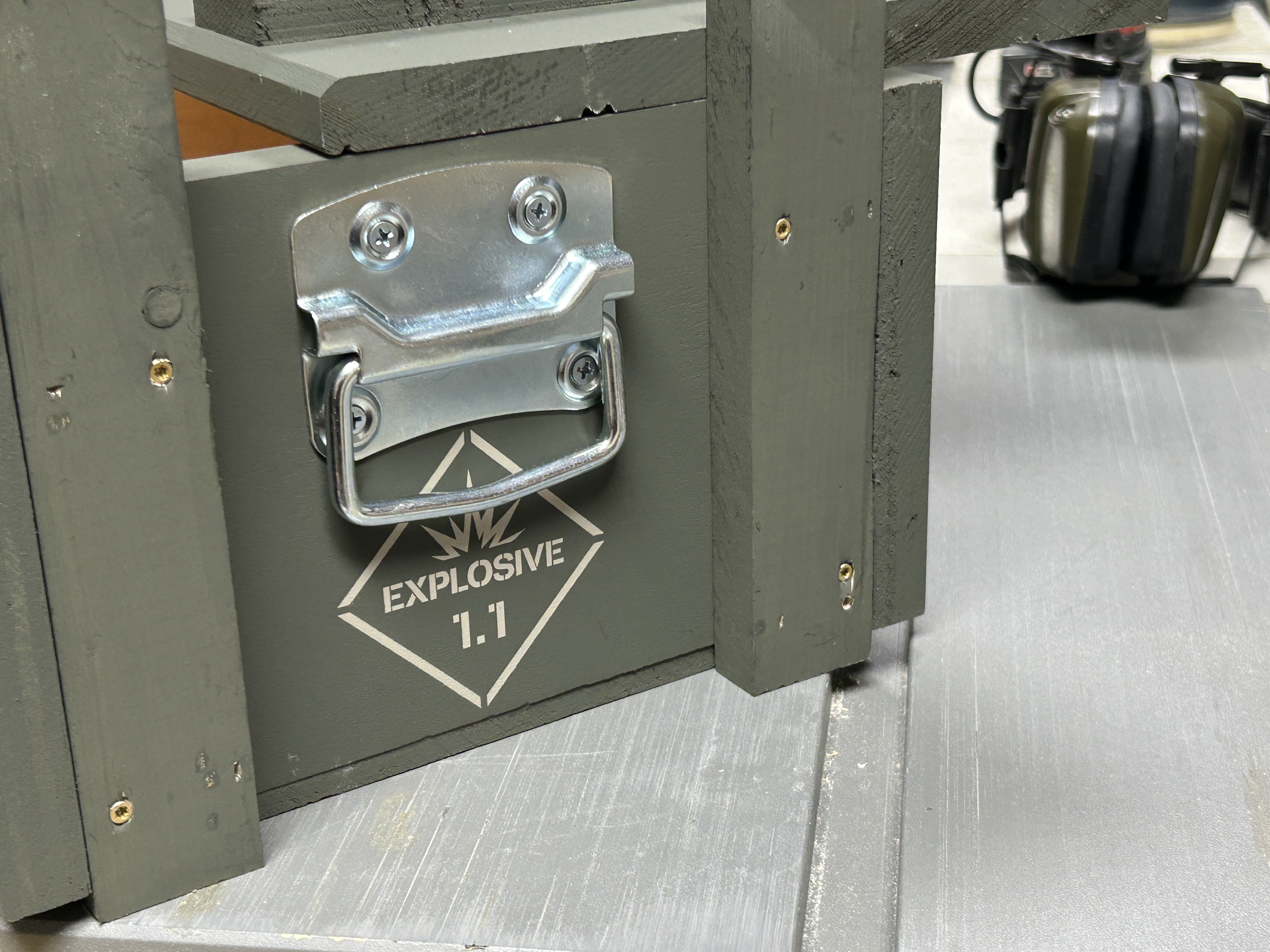 Side handle and explosive marking detail on Claymore Field Crate Standard Edition