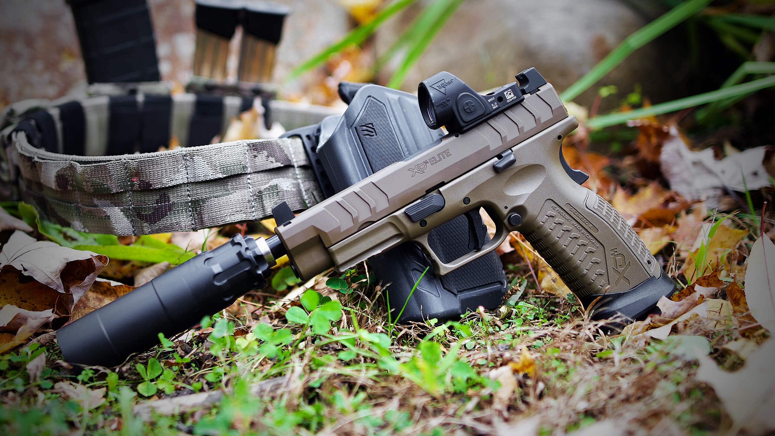 Suppressor shown outdoors as part of a Freedom News gear discussion