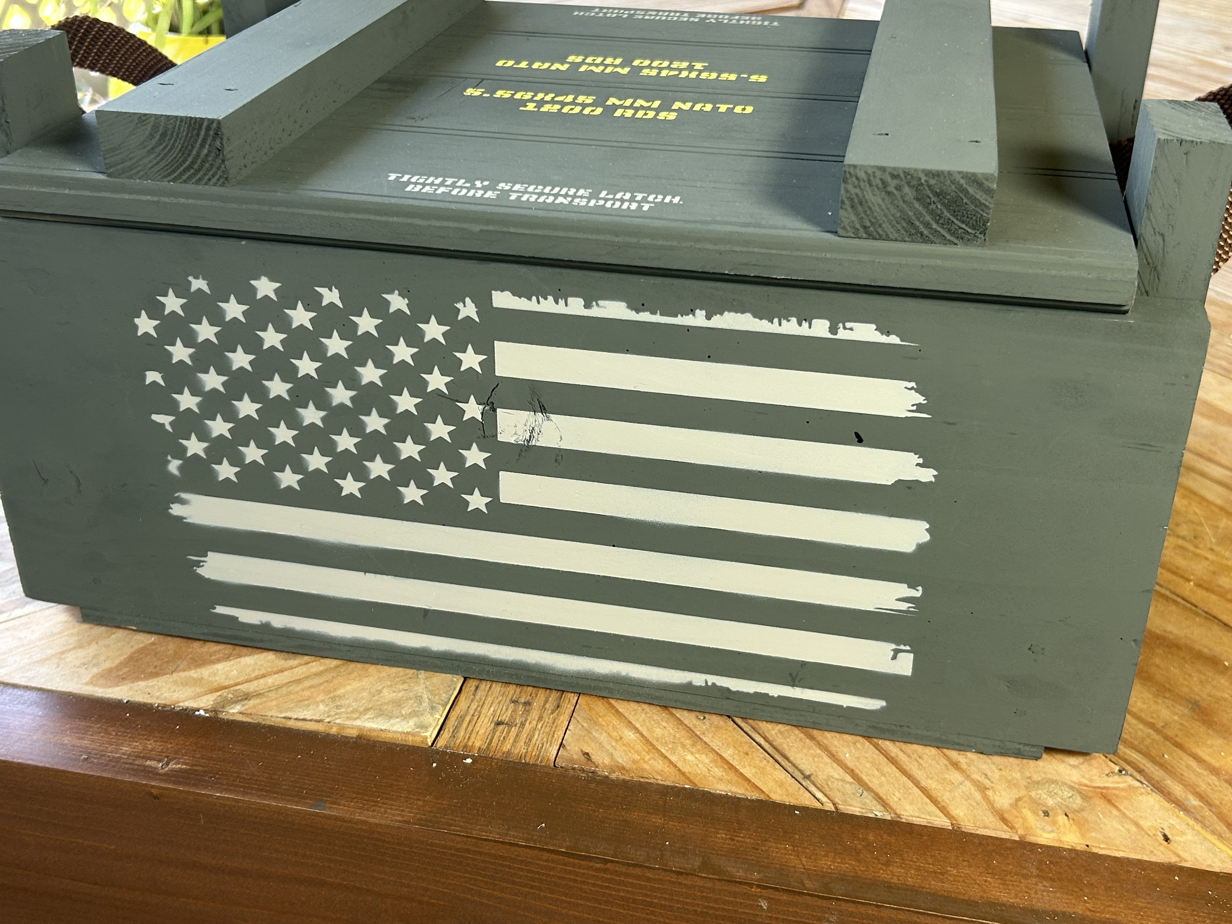 Handcrafted wooden ammo box with distressed American flag stencil