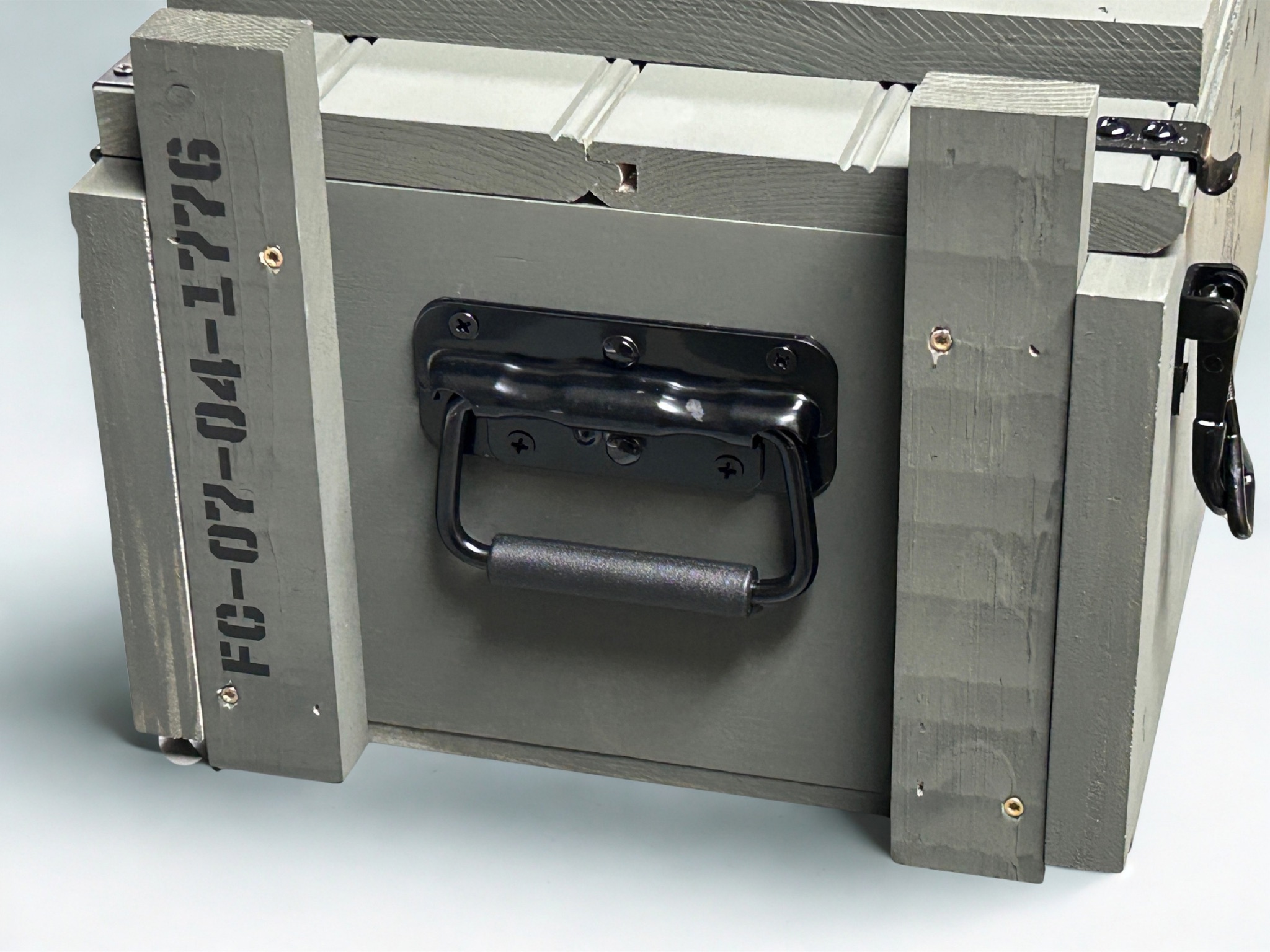 Black spring-loaded handle on Liberty Edition ammo crate