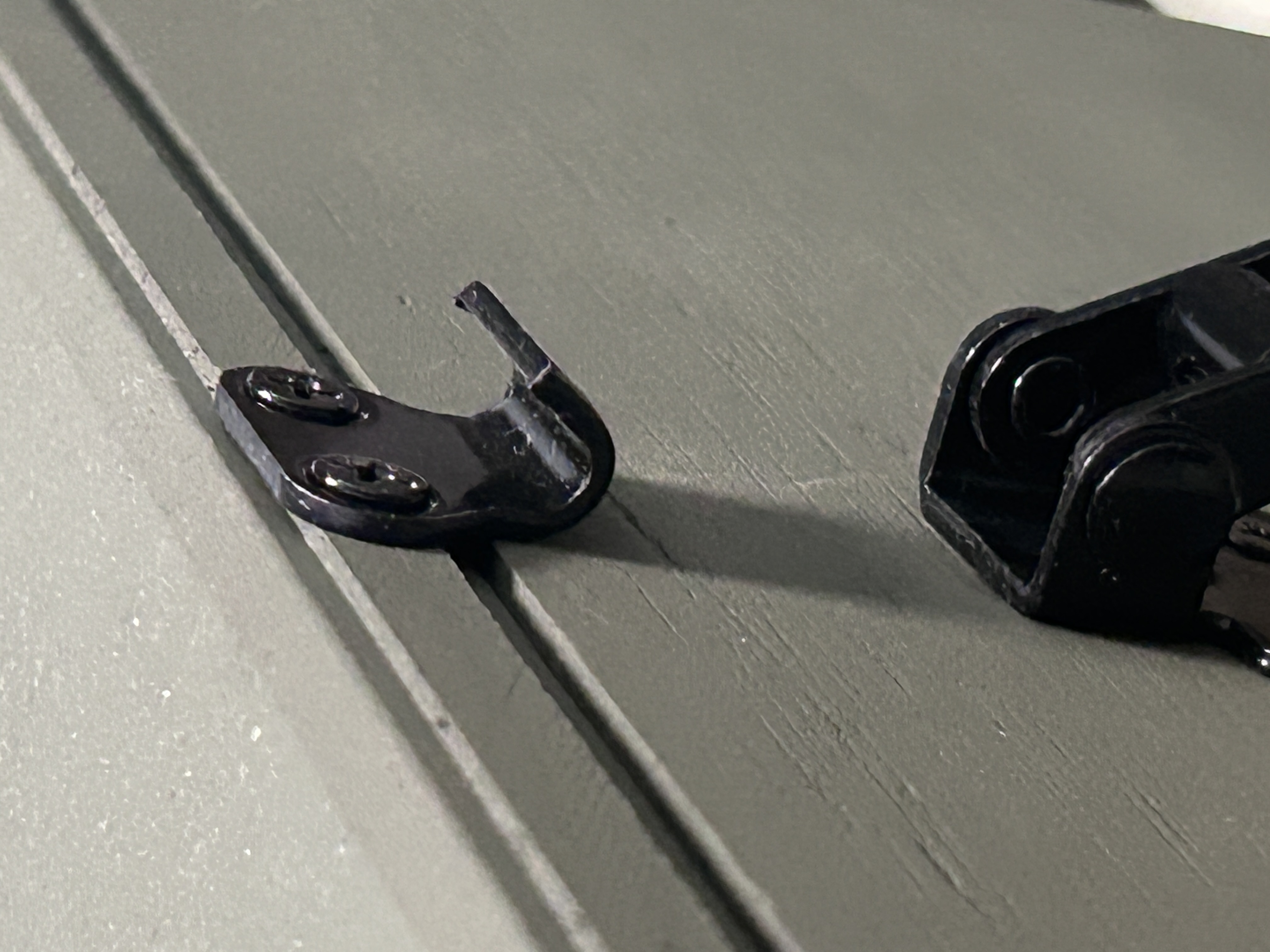 Protex 90-degree black latch catch installed on ammo box