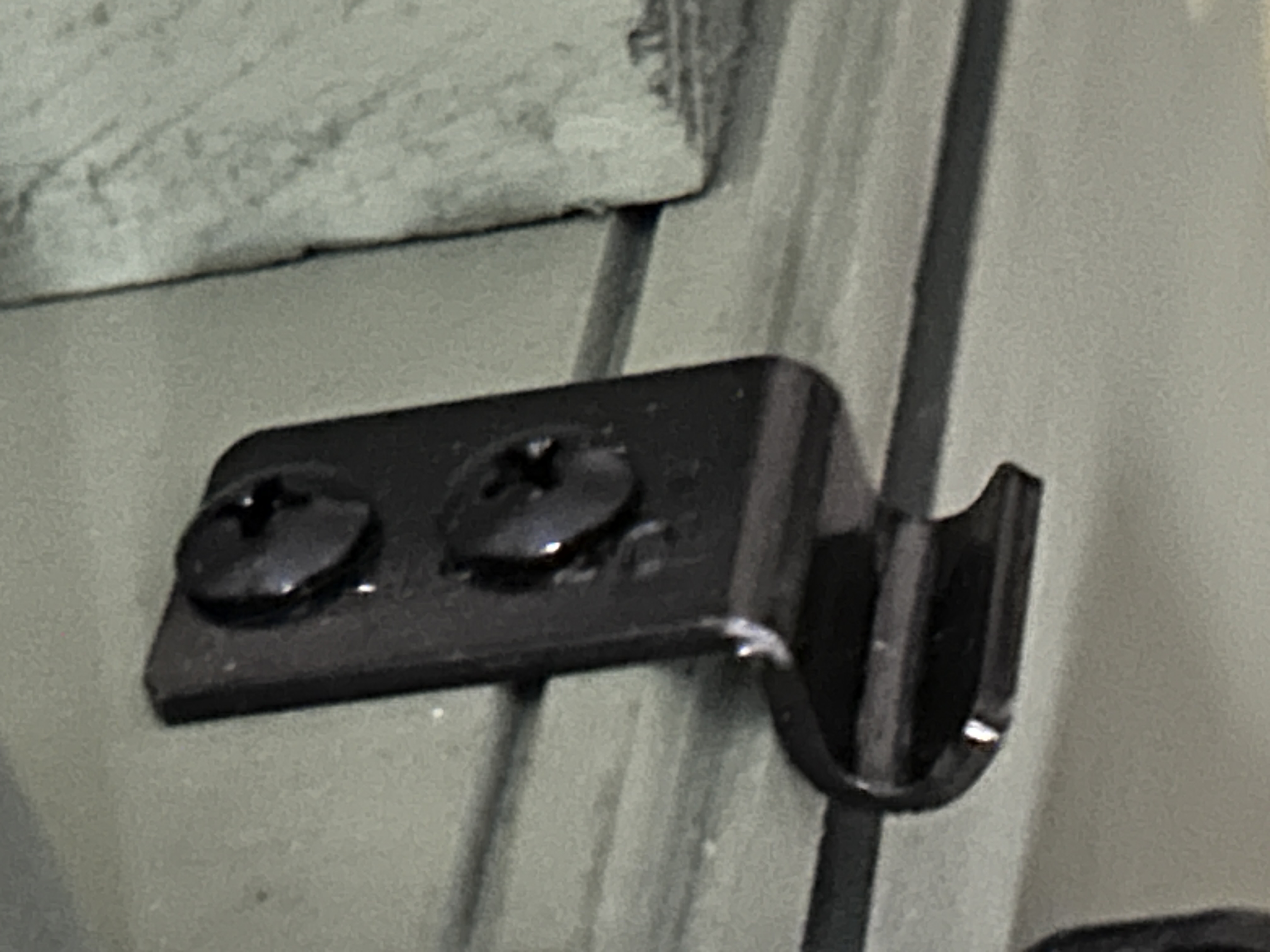 Protex 90-degree black latch catch mounted into long-grain wood