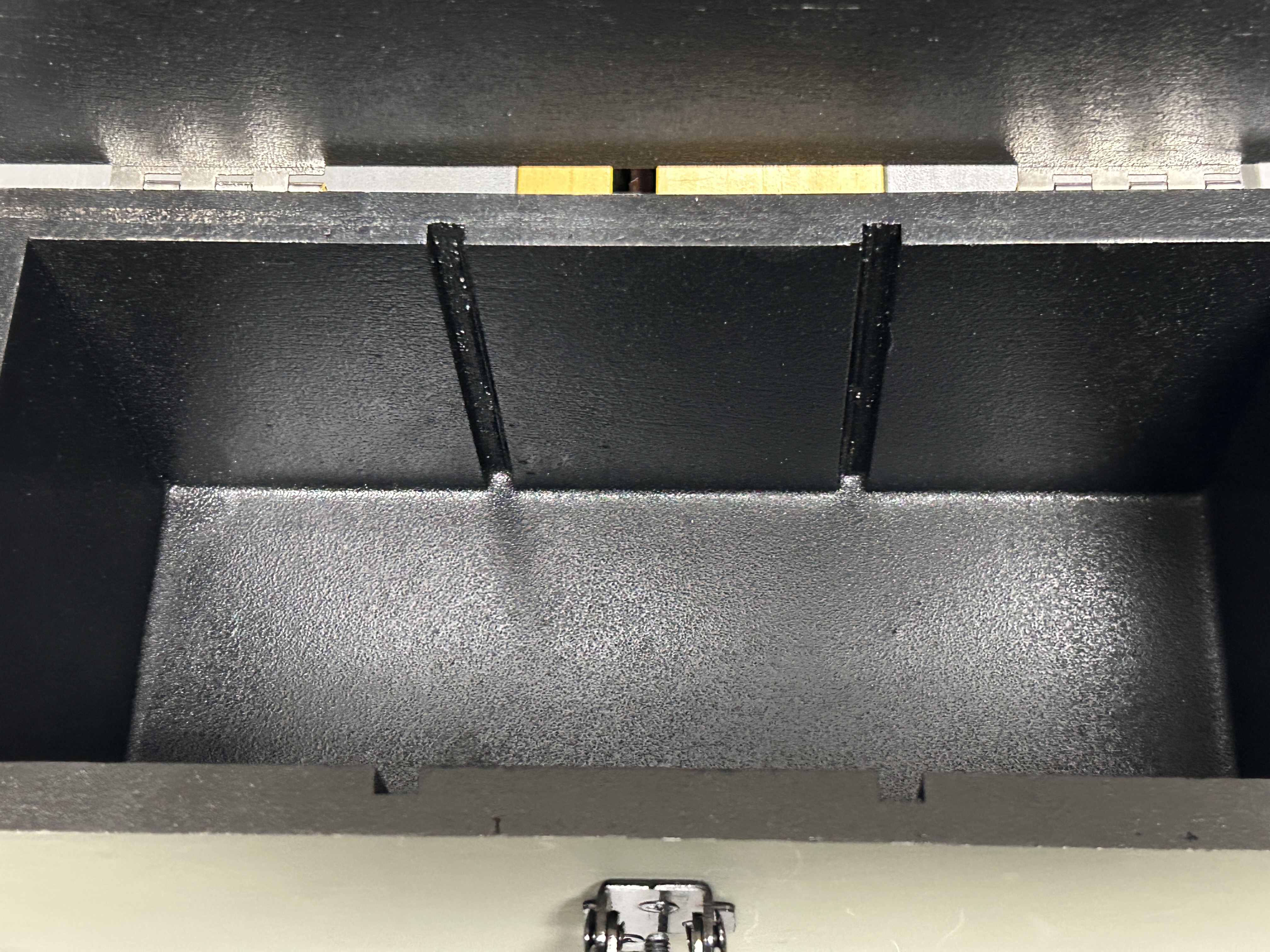 Rangemaster 400 interior showing black Herculiner sprayed over penetrating epoxy Armor Core layer